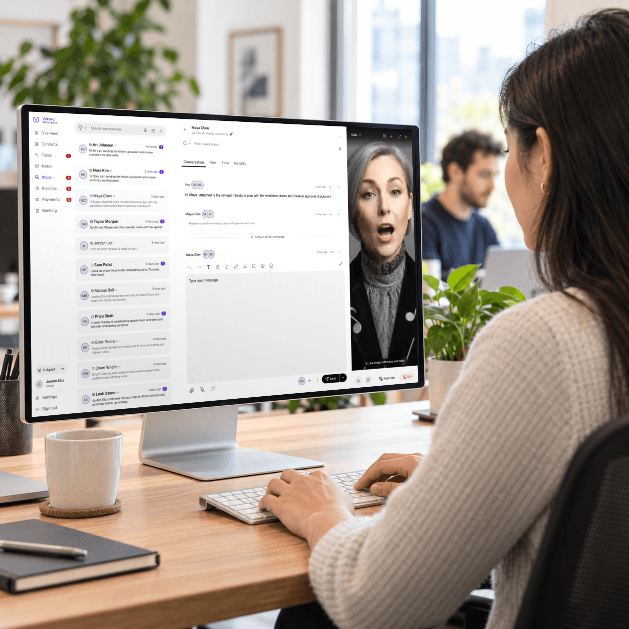 A professional using Vakara’s customer conversation workspace on a large office monitor
