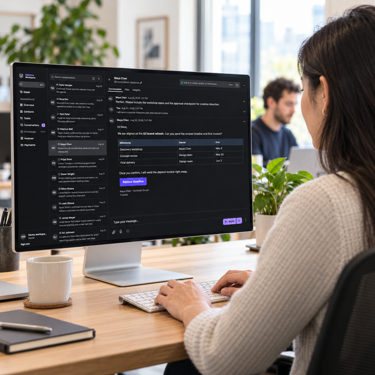 A professional using Vakara’s customer conversation workspace on a large office monitor